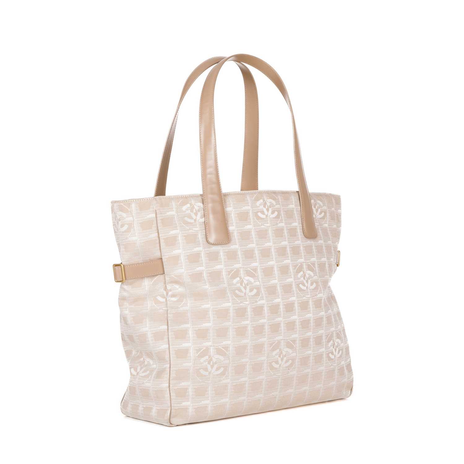 Chanel, a Travel Line tote, designed with a pale pink logo patterned canvas exterior, with beige - Image 3 of 4