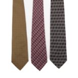 Fendi, three silk ties, to include a tonal purple FF monogram patterned tie, a black and grey