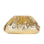 Bottega Veneta, an oversized Pouch clutch, crafted from metallic gold crinkled leather, featuring