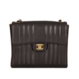 Chanel, a vintage vertical Classic Flap handbag, crafted from black lambskin leather, with