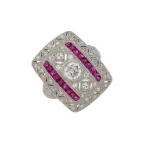 A platinum diamond and ruby openwork dress ring