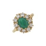 An 18ct gold emerald and diamond cluster ring