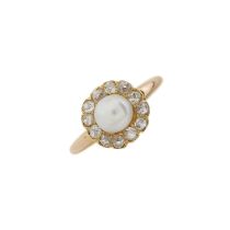 An early 20th century gold pearl and diamond cluster ring
