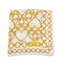 Moschino Boutique, a silk scarf, designed with a gold heart-shaped chain pattern on a white