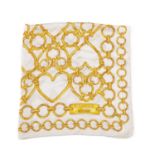 Moschino Boutique, a silk scarf, designed with a gold heart-shaped chain pattern on a white
