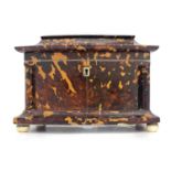 A Regency tortoiseshell tea caddy, circa 1820, of bow-fronted sarcophagus form with silver wire