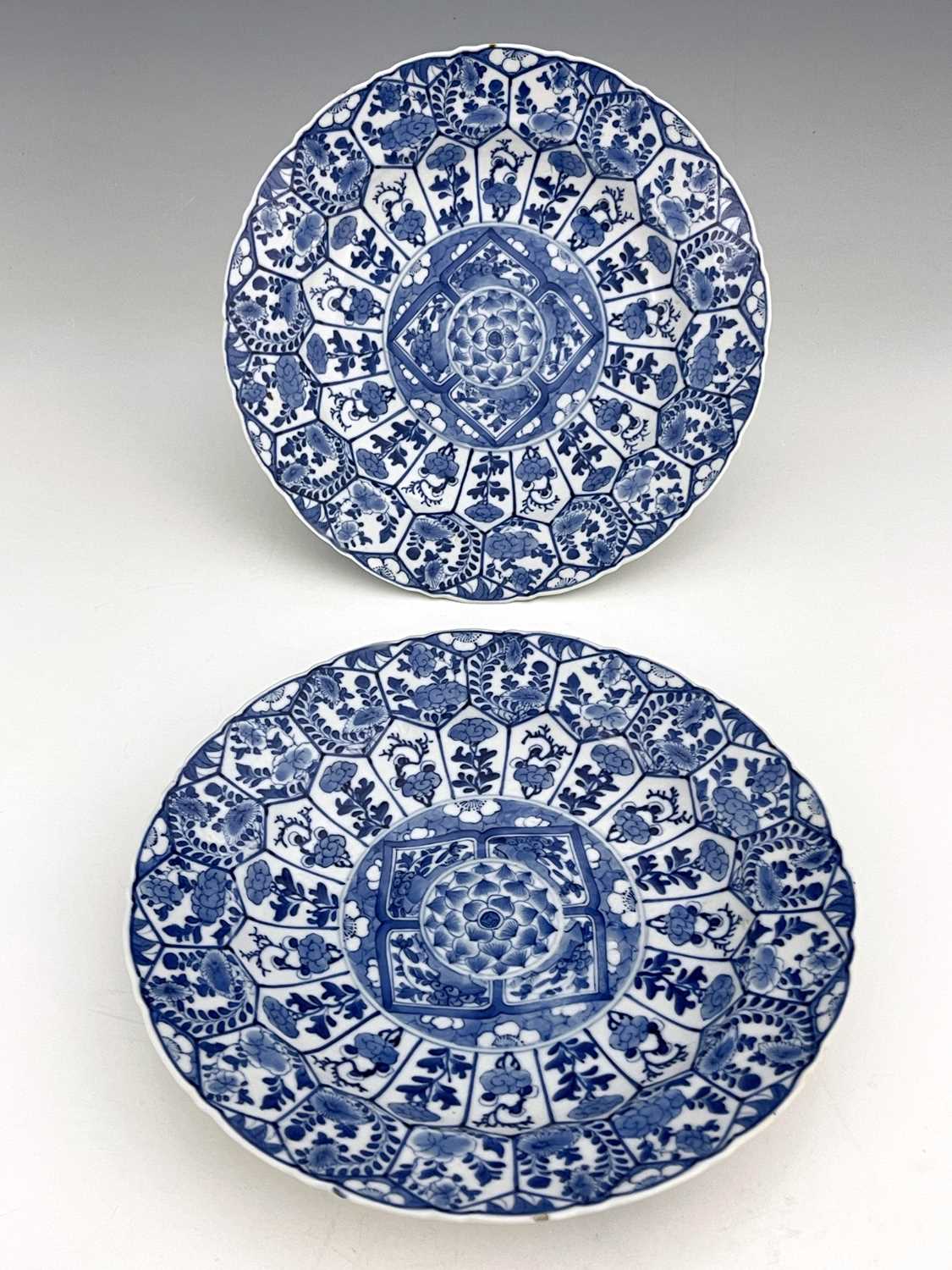 Two Chinese blue and white plates, lotus mark, painted in the Kangxi style, circular ogee moulded