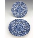 Two Chinese blue and white plates, lotus mark, painted in the Kangxi style, circular ogee moulded