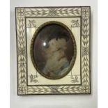 An 18th century portrait miniature painted to depict a young bewigged woman with black ostrich