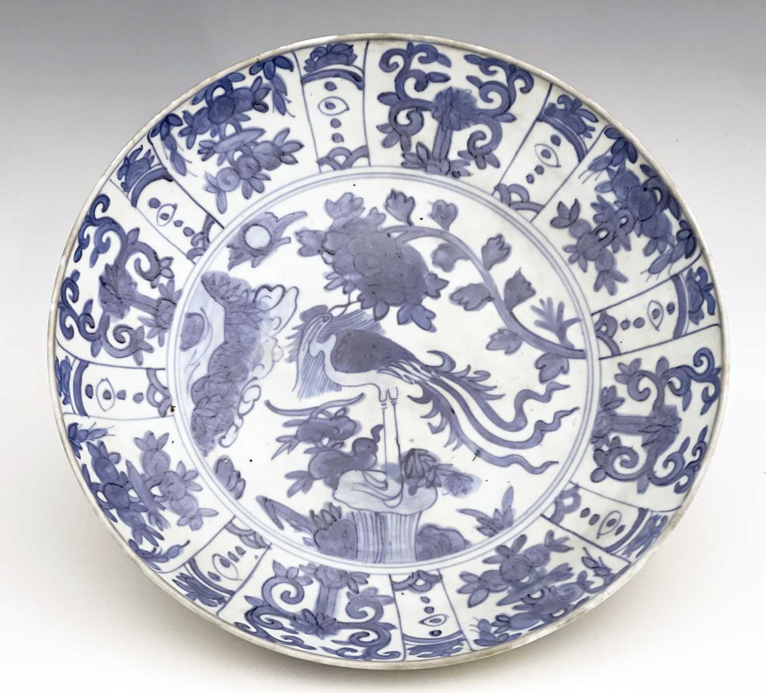 A Chinese blue and white dish, Ming, painted with a bird on rock with peony design, within a - Image 5 of 5