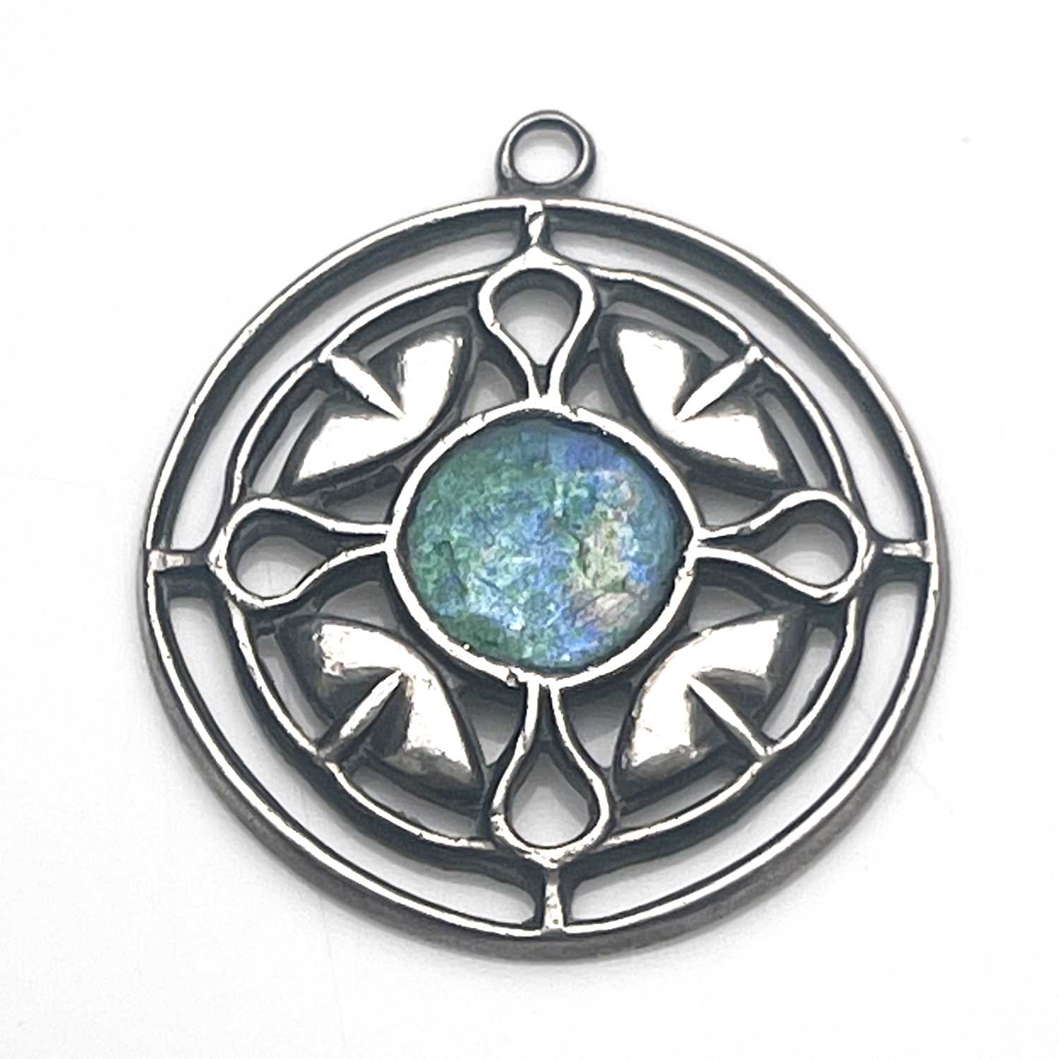 Jessie M King for Liberty and Co., an Arts and Crafts silver and enamelled pendant, circular form,