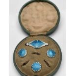 An Arts and Crafts silver gilt and enamelled button and brooch set, James Atkinson, Birmingham 1905,