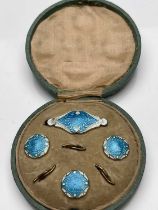 An Arts and Crafts silver gilt and enamelled button and brooch set, James Atkinson, Birmingham 1905,