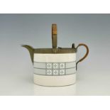 WMF, a Jugendstil ceramic and metal mounted teapot, straight sided oval form, decorated with a