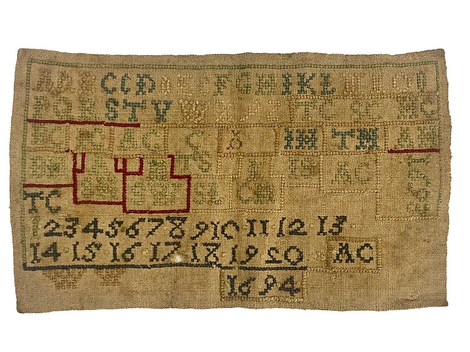 A 17th century William and Mary sampler, dated 1693 and 1694, embroidered in white, blue, green, red