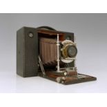 An Eastman Kodak Cartridge concertina camera, brown bellows, with ivorine Sands Hunter plaque,