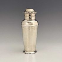 An Art Deco silver cocktail shaker, Adie Brothers, Birmingham 1929, shouldered milk churn form