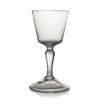 A Dutch wine glass, circa 1760, the bucket bowl on an inverse baluster stem and folded conical foot,