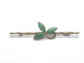 A Chinese 14ct gold jade brooch, bamboo bar with jade cabochon leaves, 6cm long