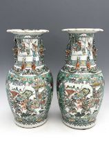 A pair of Chinese famille verte vases, shouldered form, applied with lizards to the necks and shishi