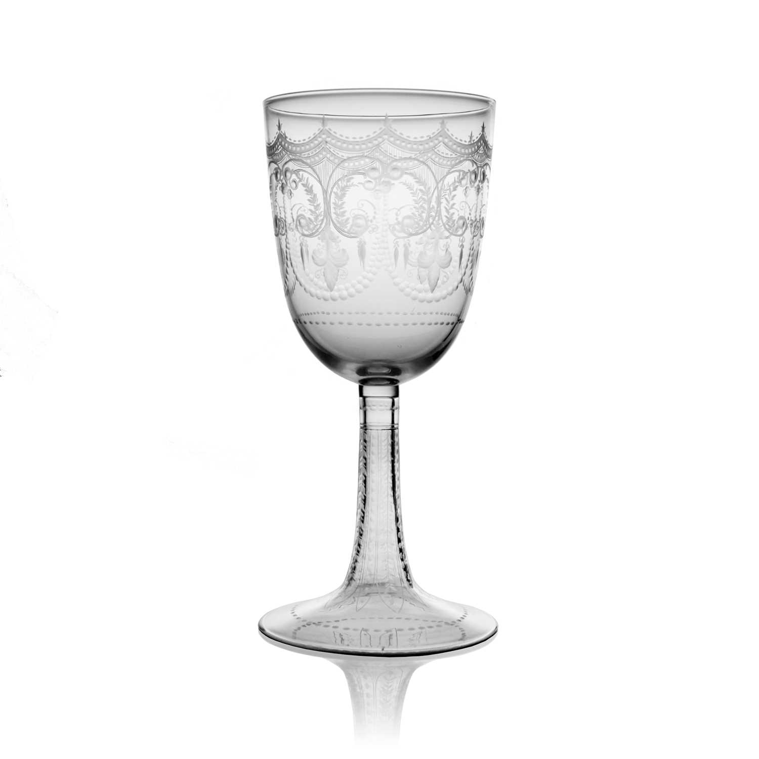 A Stourbridge engraved glass wine goblet, circa 1880, the large rounded bowl decorated with festoons