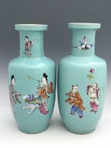 A pair of Chinese turquoise ground vases, shouldered rolo form, painted with deity figures in