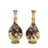 Kate Rogers for Doulton Lambeth, a pair of Carrara Ware painted vases, slender necked baluster