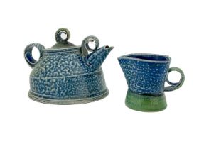 Jane Hamlyn, a studio pottery teapot, salt glazed stoneware, wide domed form with coiled handle