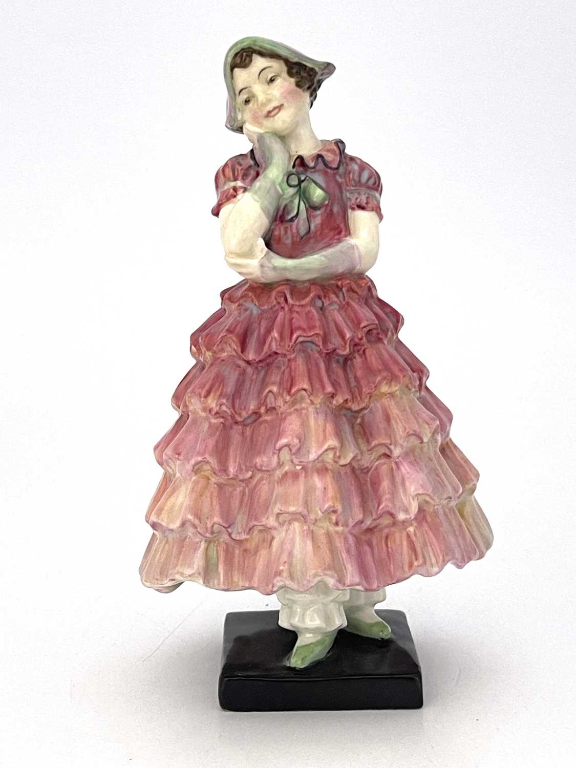 A Royal Doulton figure, Maisie, HN1619, in pink ruffled dress, painted marks, 15.5cm high