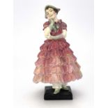 A Royal Doulton figure, Maisie, HN1619, in pink ruffled dress, painted marks, 15.5cm high