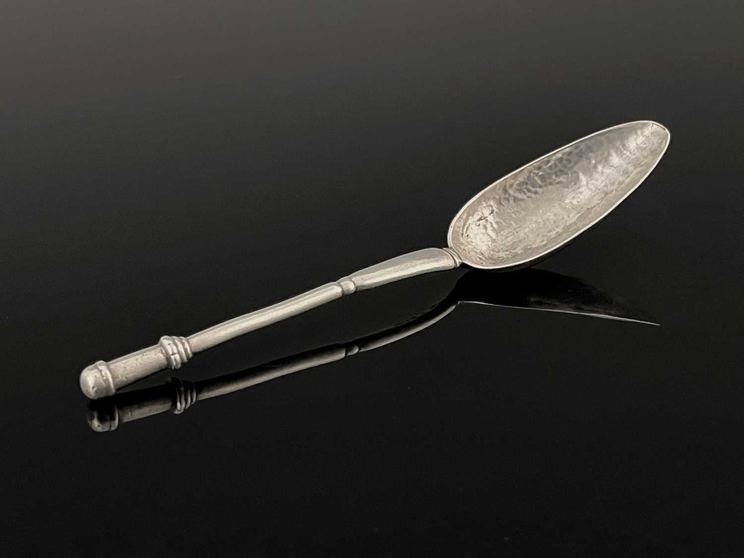 An Arts and Crafts silver grapefruit spoon, Winifred King, Birmingham 1926, the deep elongated ovoid