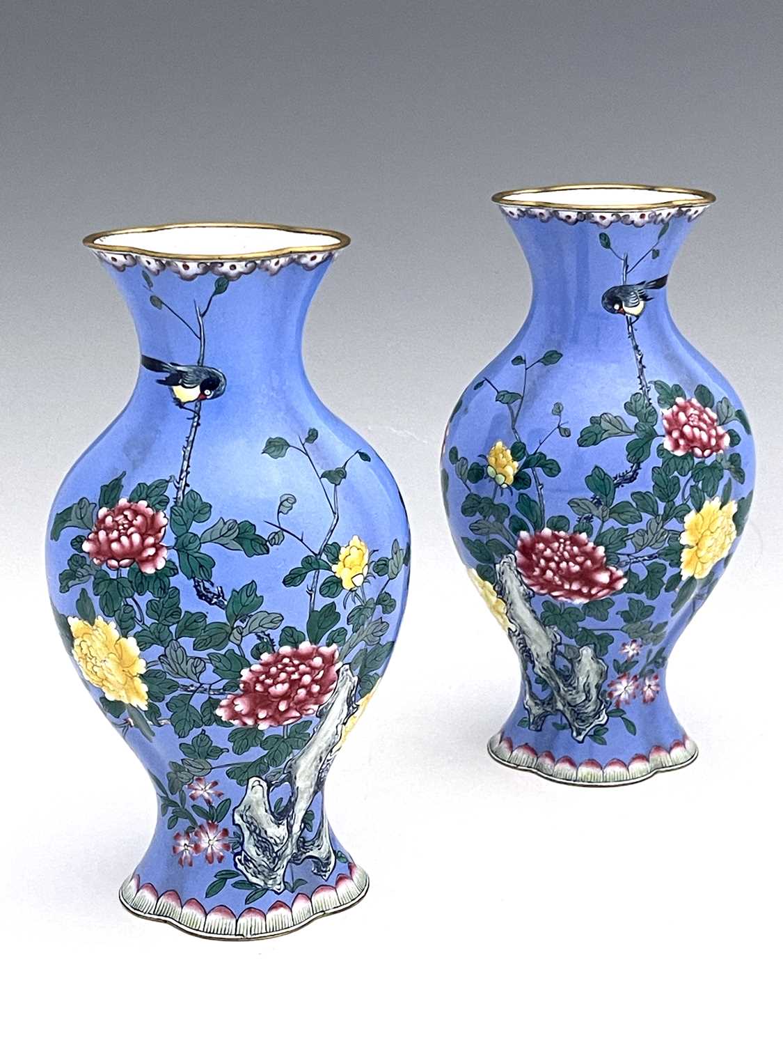 A pair of Chinese famille rose enamelled metal vases, lobed baluster form, painted with naturalistic