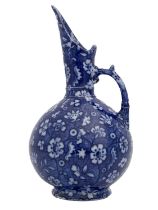 An Aesthetic Movement blue and white jug, Keeling and Co., in the style of Christopher Dresser,