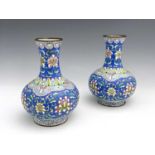 A pair of Chinese famille rose enamelled metal vases, footed baluster form, painted in the
