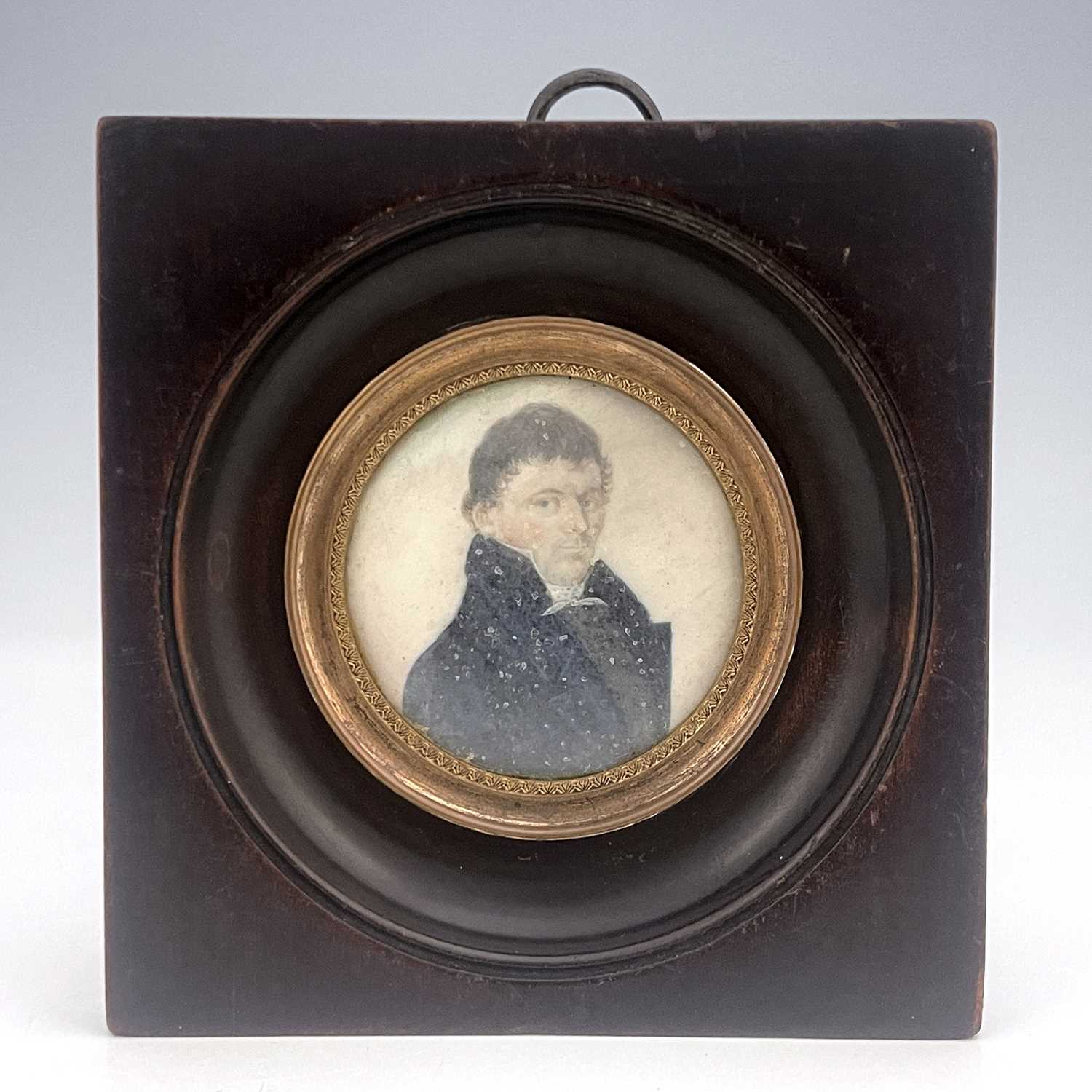 An early 19th century portrait miniature painted to depict a man in a high-collared blue coat, on - Image 2 of 2