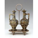 Isabella Miller for Doulton Lambeth, a stoneware oil and vinegar cruet in silver plated stand,