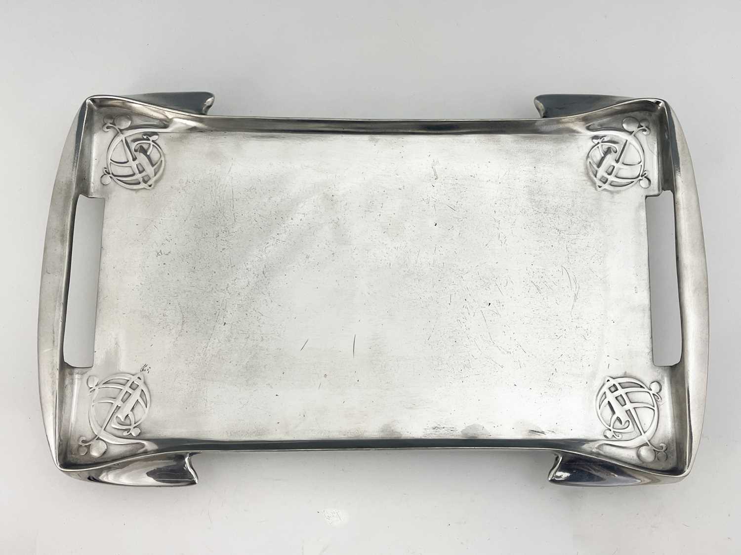 Archibald Knox for Liberty & Co, a Tudric pewter tray, circa 1905, with integral handles,