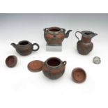 A Chinese Yixing four piece tea set, pewter overlaid redware, chased dragon design below Chinese