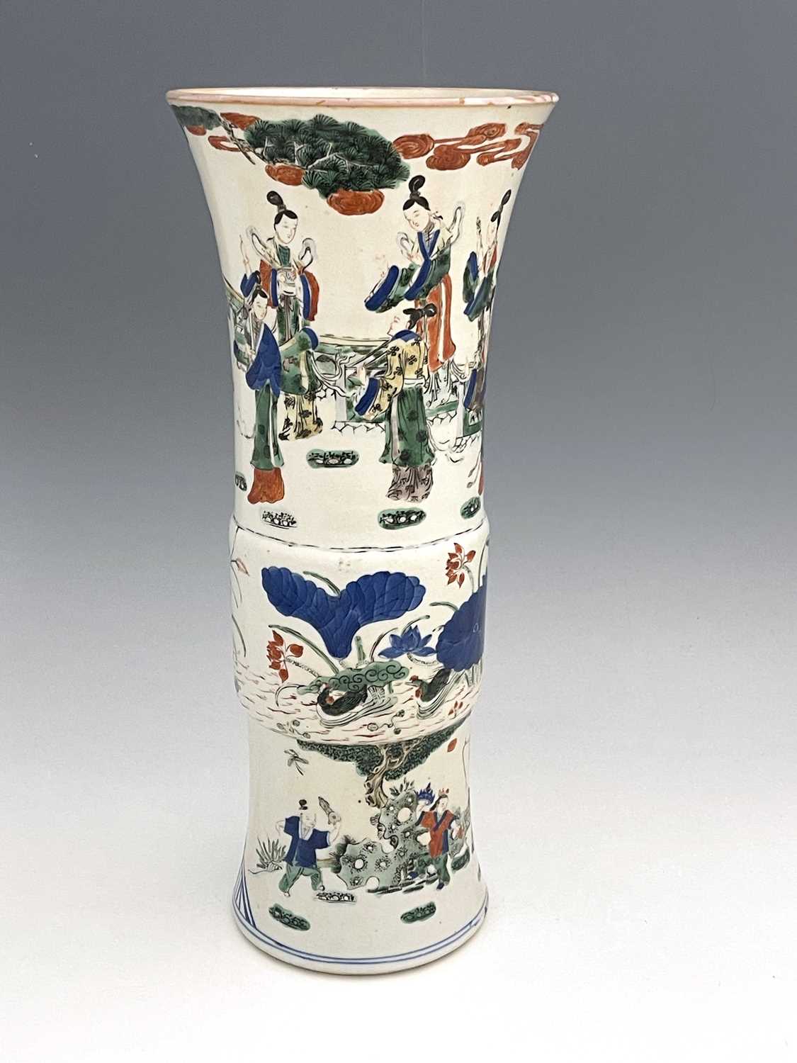 A Chinese Doucai Gu vase, cylindrical flared form, painted in the round with three bands,