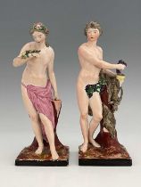 A pair of Staffordshire pottery figures of Ariadne and Dionysus, modelled semi nude standing next to