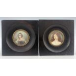 A pair of 19th-century portrait miniatures, finely painted to depict young women, one in the pre-