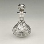 An American Art Nouveau silver overlay scent bottle, circa 1900, bulbous form with hollow