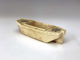 A Doulton Lambeth advertising novelty tug boat, glazed stoneware, impressed marks, printed logos,