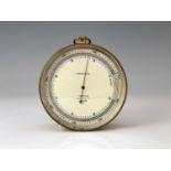 T. Wheeler, London, an early 20th Century Compensated brass military marine barometer, silvered