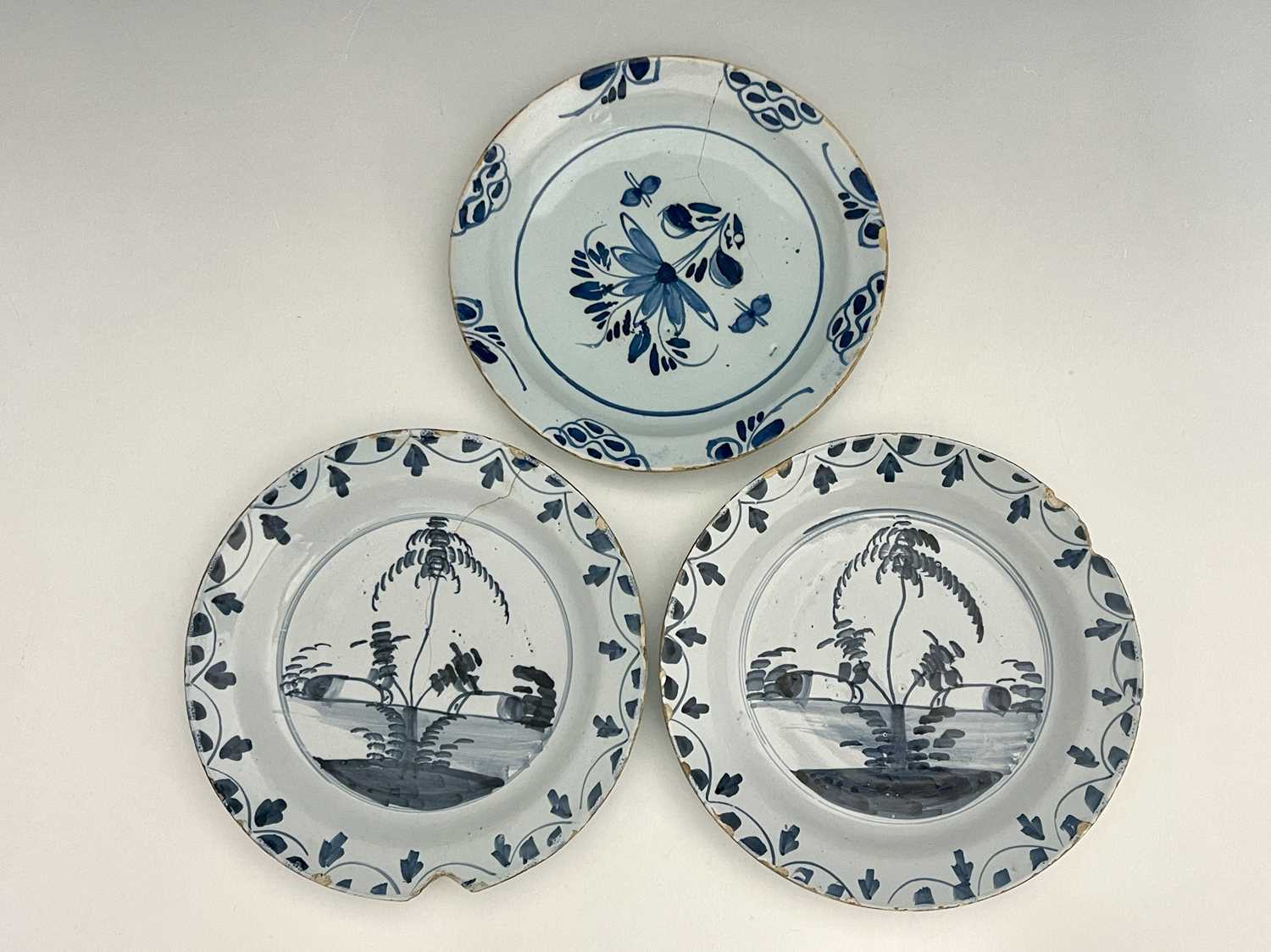 Two Lambeth Delft blue and white plates, circa 1760, each decorated with pairs of rabbits and