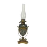 Mark V Marshall for Doulton Lambeth, a stoneware and brass oil lamp, egg form, carved in relief with