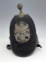 A Victorian First Sussex Artillery Volunteers helmet, ball finial, with helmet plate incorporating