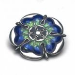 Queensway for Liberty and Co., an Arts and Crafts silver and enamelled brooch, in the form of a