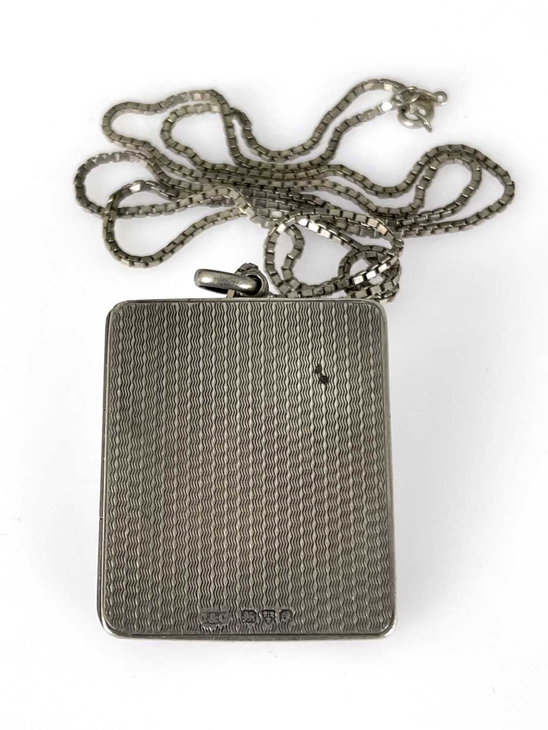 A George V silver pendant locket photo frame, Cohen and Charles, Chester 1917, rectangular form, - Image 3 of 4