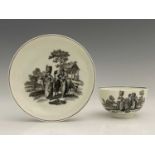 A Worcester black and white printed tea bowl and saucer, circa 1765, printed with the Milkmaid
